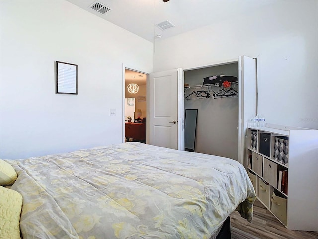 bedroom featuring hardwood / wood-style flooring and a closet