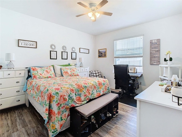 bedroom with ceiling fan and dark hardwood / wood-style flooring