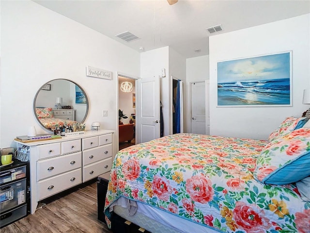 bedroom with wood-type flooring