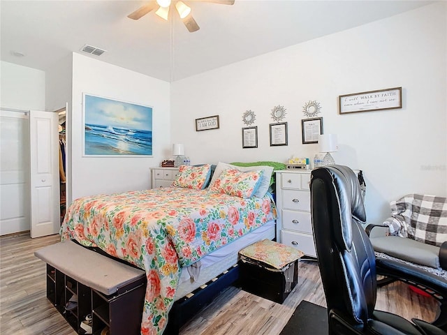 bedroom with ceiling fan and light wood-type flooring