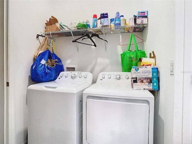 washroom featuring washer and clothes dryer