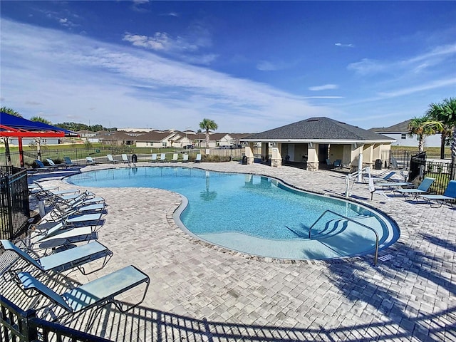 view of swimming pool with a patio area