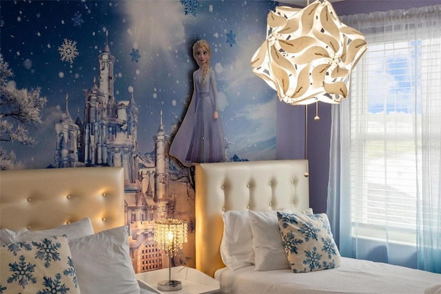 bedroom with wallpapered walls