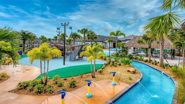 view of property's community featuring a swimming pool and a patio
