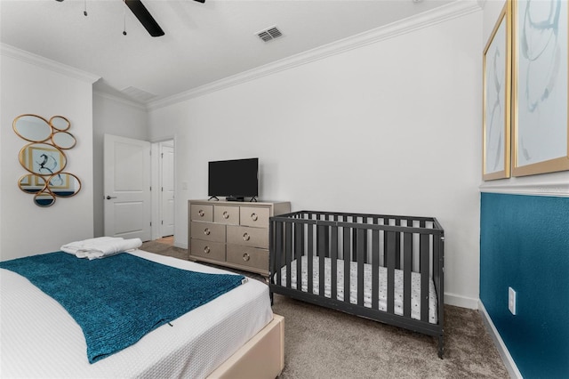 bedroom with ceiling fan, crown molding, and carpet floors