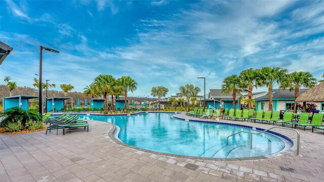 view of pool featuring a patio