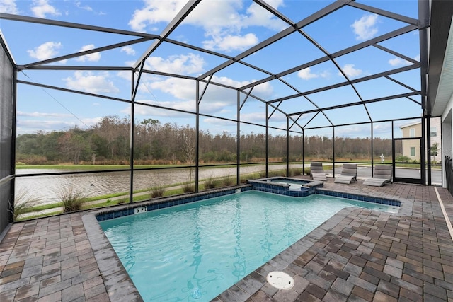 view of pool with a lanai, a water view, a patio, and an in ground hot tub