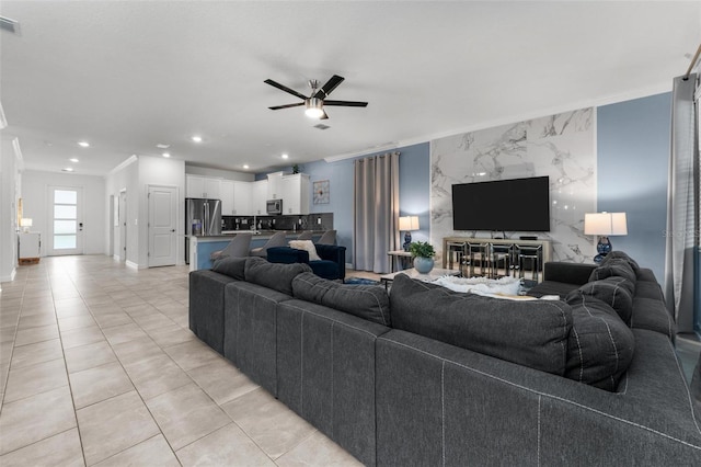 living room with recessed lighting, ceiling fan, light tile patterned flooring, and ornamental molding