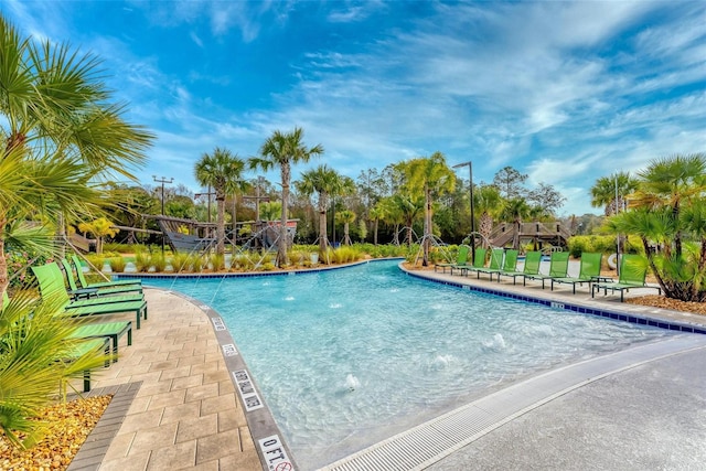 view of swimming pool featuring pool water feature