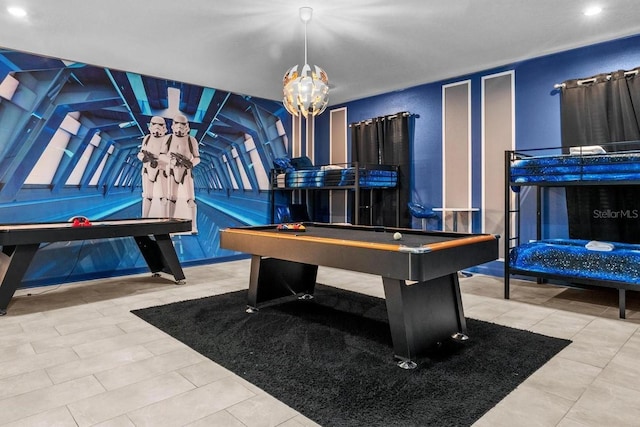 recreation room featuring a notable chandelier and pool table