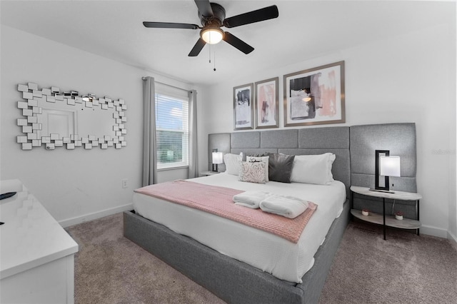 bedroom featuring baseboards, dark carpet, and a ceiling fan