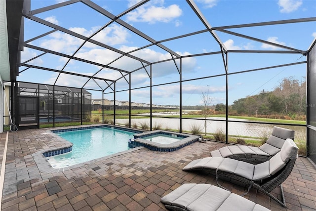 view of pool featuring a patio, a water view, a lanai, and a pool with connected hot tub