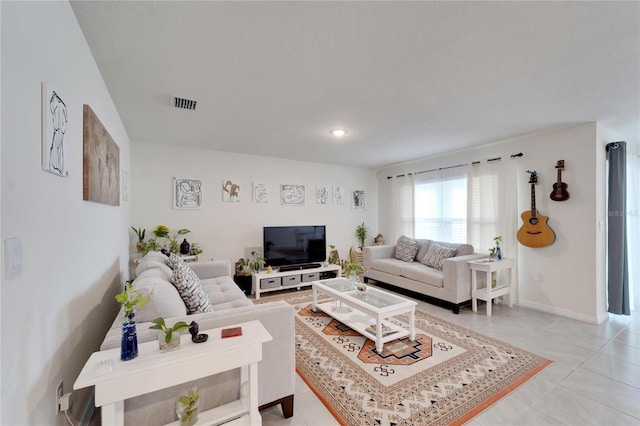 living room with light tile patterned floors