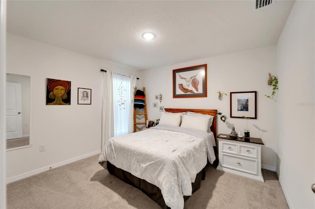 bedroom with light colored carpet