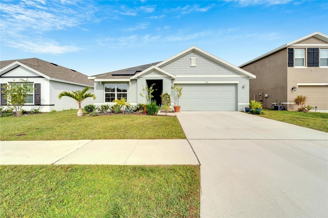 view of front of home with solar panels and a front yard