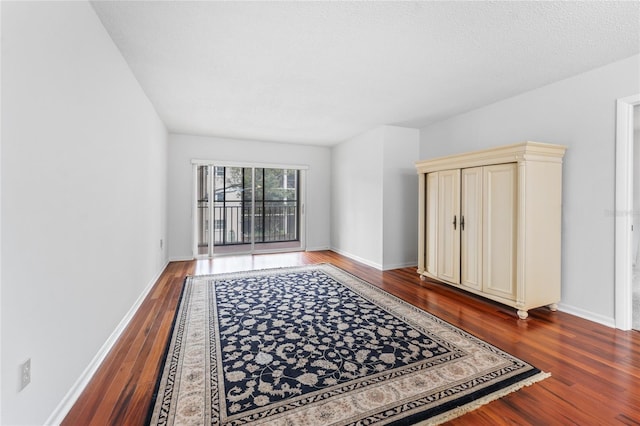 interior space with dark hardwood / wood-style flooring