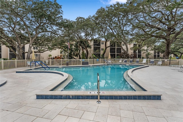 view of swimming pool featuring a patio area