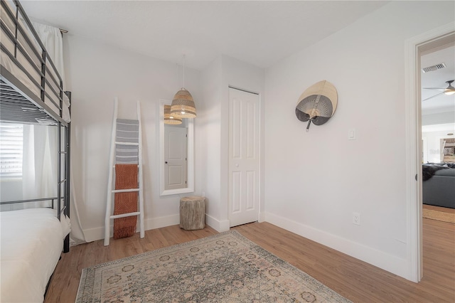 interior space with light wood-type flooring and ceiling fan