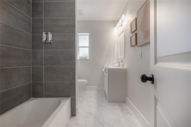 full bathroom with vanity, toilet, and tiled shower / bath combo