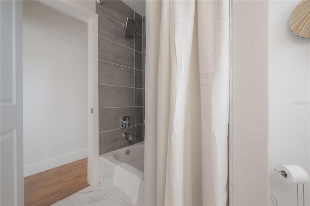 bathroom featuring shower / tub combo with curtain and hardwood / wood-style floors