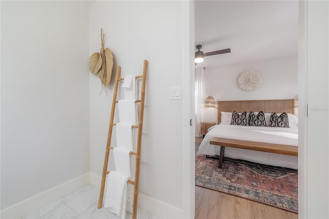 bedroom featuring ceiling fan and light hardwood / wood-style flooring