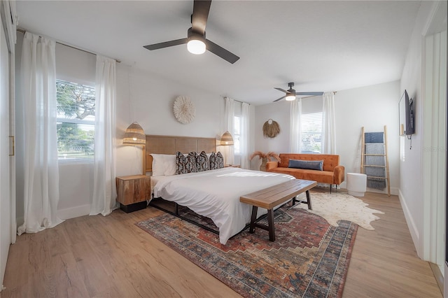 bedroom featuring ceiling fan and light wood-type flooring