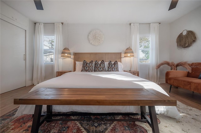 bedroom featuring hardwood / wood-style floors and ceiling fan