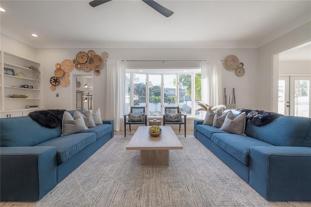 living room with carpet flooring and ceiling fan