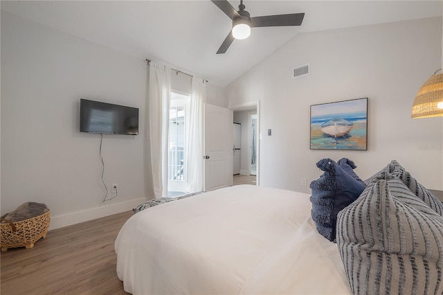 bedroom featuring vaulted ceiling, hardwood / wood-style floors, and ceiling fan