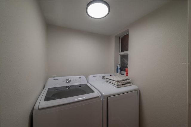 laundry room with separate washer and dryer