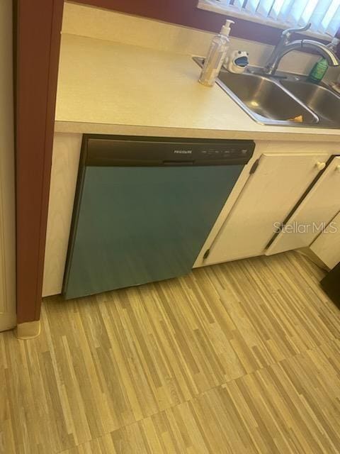 interior details featuring black dishwasher and sink