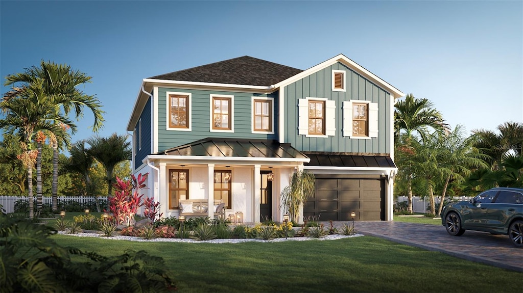 view of front of home with a garage and a front lawn