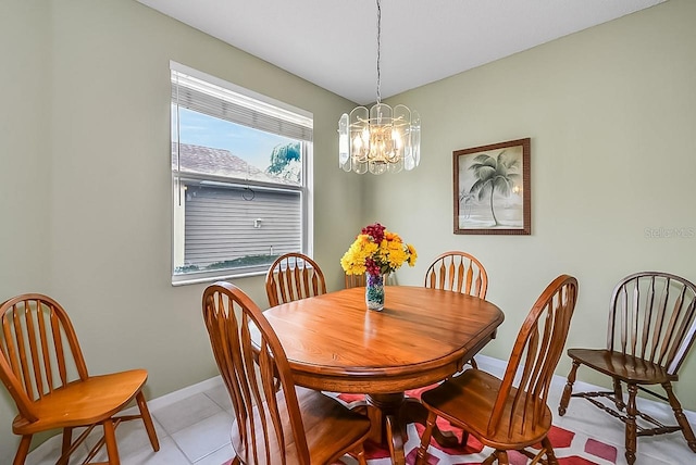 dining area featuring light tile patterned floors and an inviting chandelier