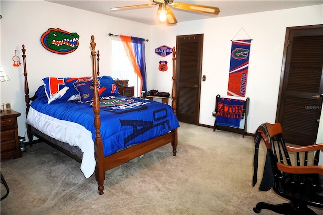 bedroom featuring light carpet and ceiling fan