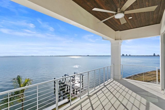 exterior space featuring a water view and ceiling fan