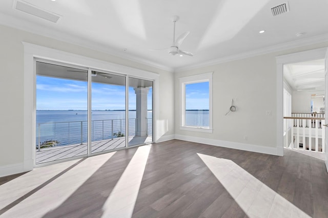 unfurnished room with dark hardwood / wood-style flooring, a water view, ceiling fan, and crown molding