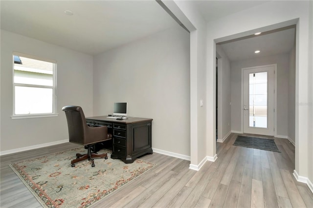 office space with light hardwood / wood-style flooring and a wealth of natural light