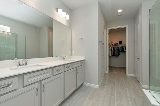 bathroom featuring dual vanity and tile patterned flooring