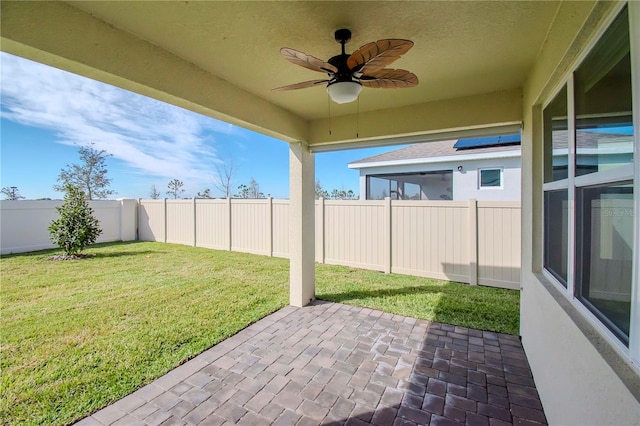 view of patio featuring ceiling fan