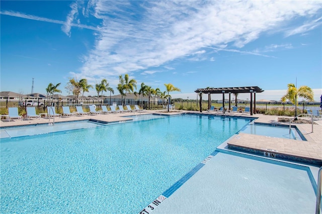 view of swimming pool with a pergola