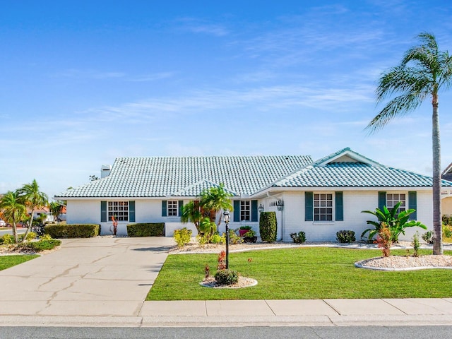 ranch-style home with a front yard