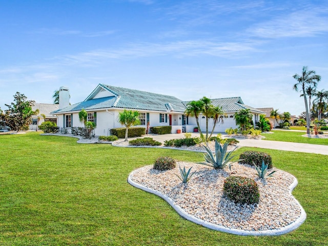 ranch-style house with a front lawn and a garage