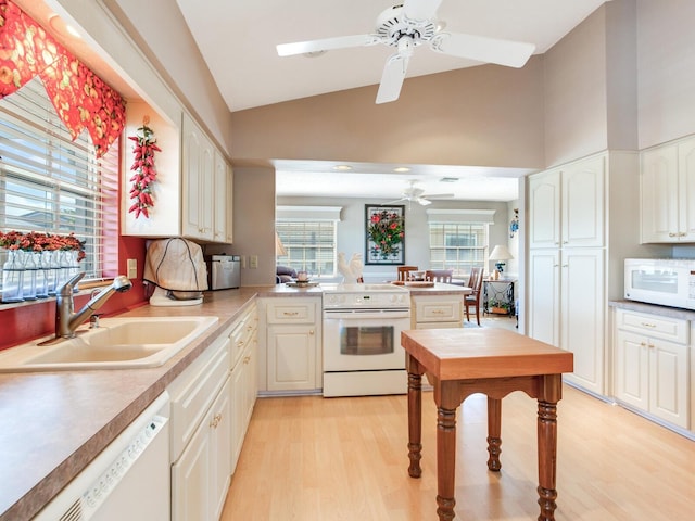 kitchen featuring ceiling fan, white appliances, light wood-type flooring, and sink