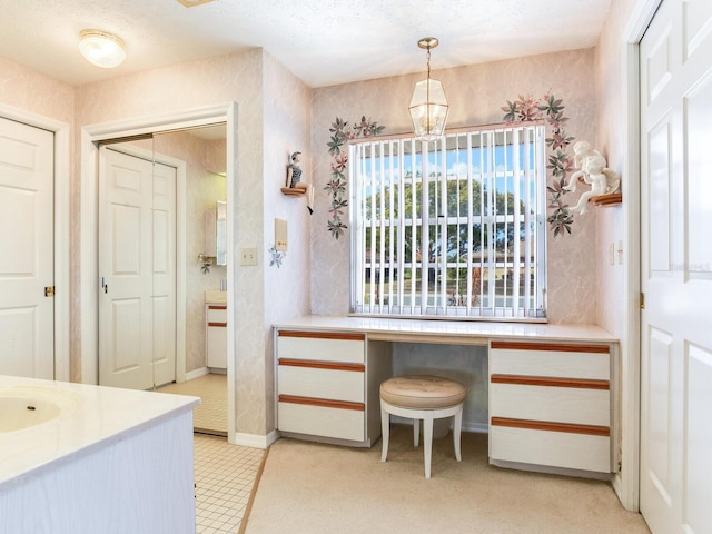 bathroom with tile floors and a textured ceiling