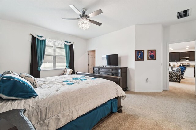 carpeted bedroom featuring ceiling fan