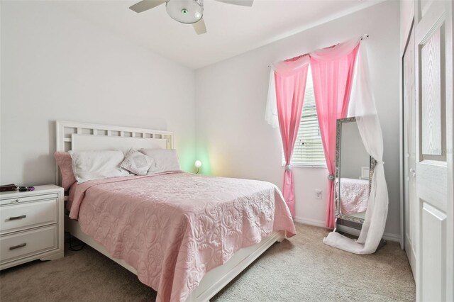 bedroom with light carpet and ceiling fan