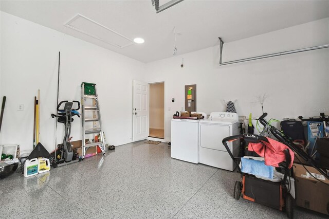 garage featuring washing machine and dryer and electric panel