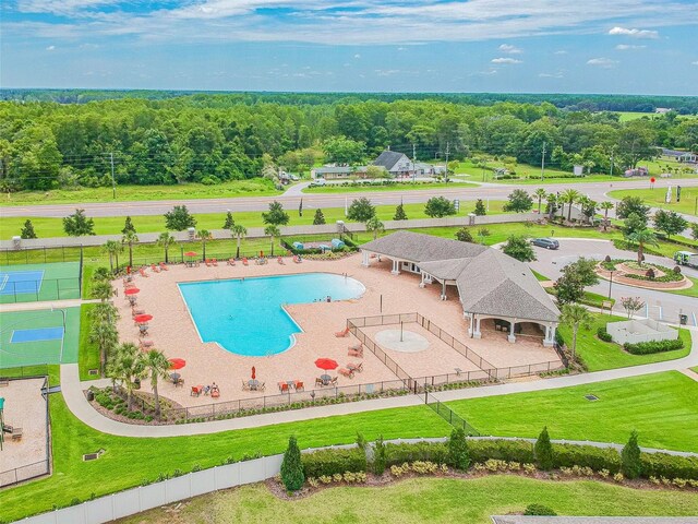 view of swimming pool featuring a patio, a yard, and a gazebo