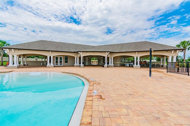 view of swimming pool with a patio area