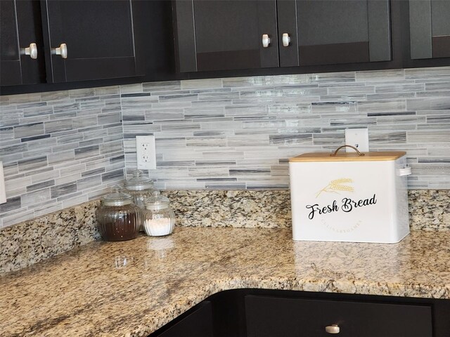 interior details with light stone countertops and tasteful backsplash